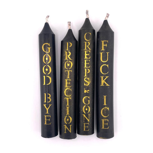 Four black taper candles with gold lettering on a white background. The candles read 'GOOD BYE', 'PROTECTION', 'CREEPS BE GONE', and 'FUCK ICE' respectively.