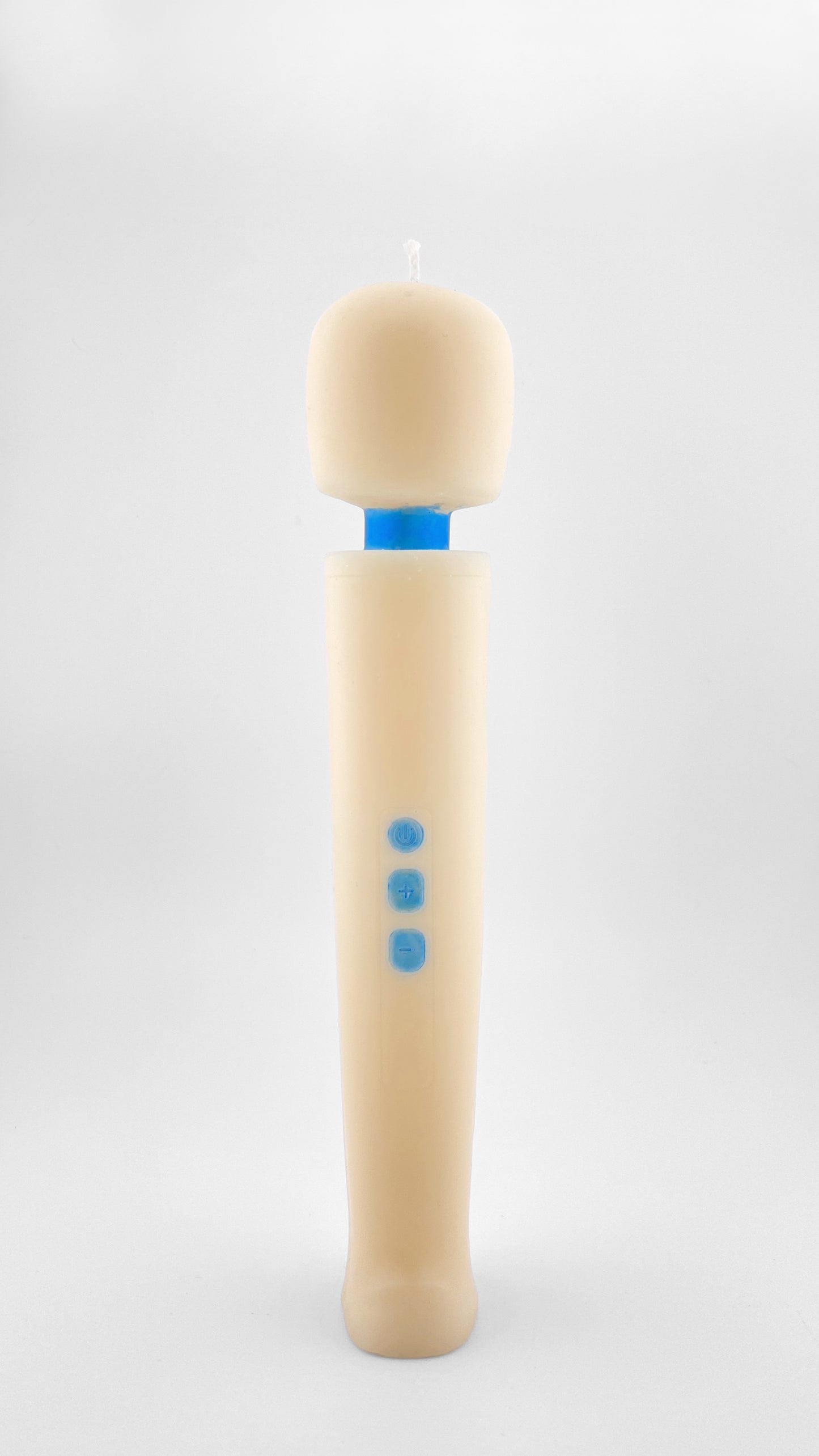 A novelty candle shaped like a handheld massager, featuring an off-whte body with three blue buttons and a blue neck resembling the iconic Magic Wand vibrator, set against a plain light gray background.