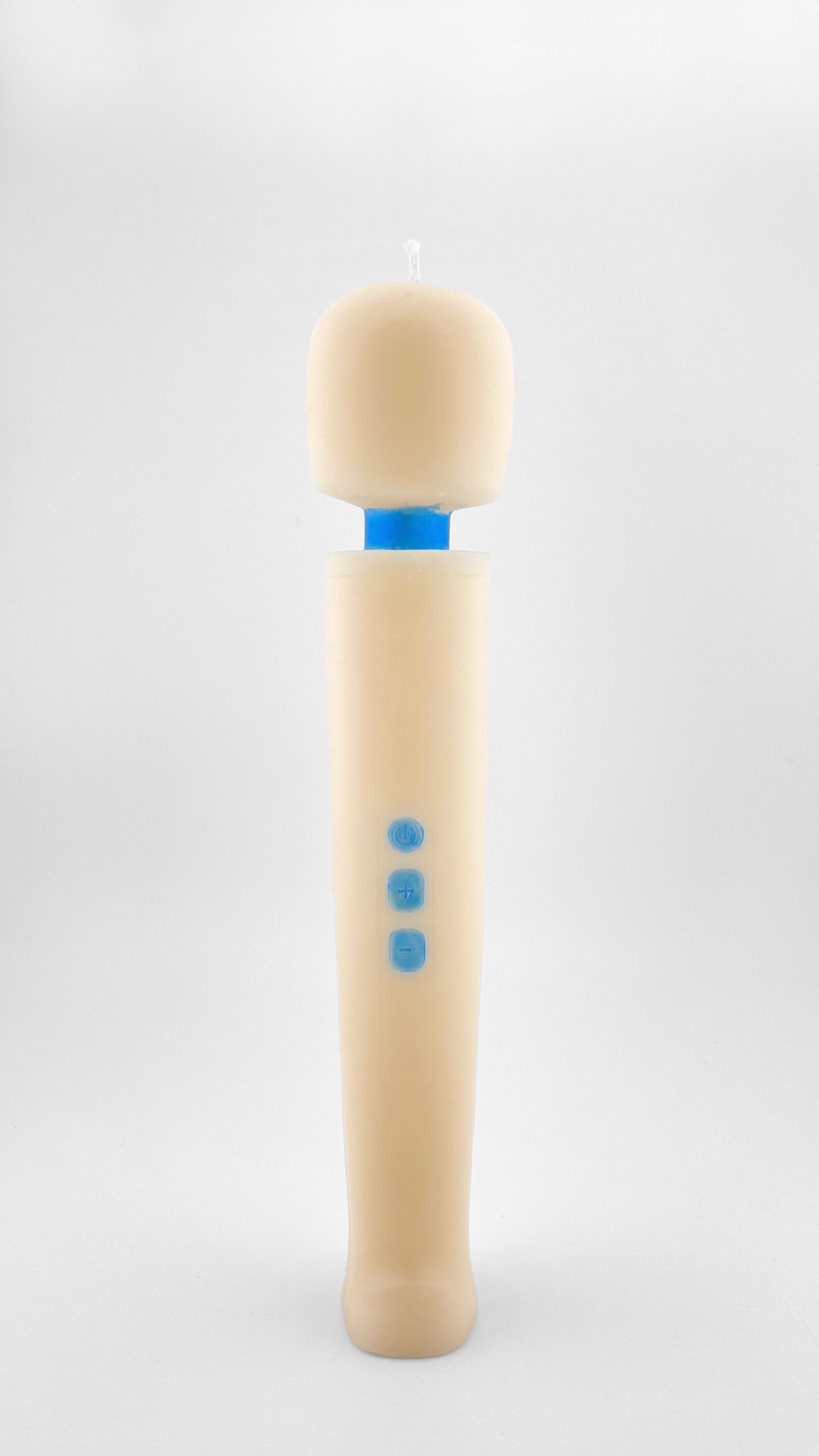 A novelty candle shaped like a handheld massager, featuring an off-whte body with three blue buttons and a blue neck resembling the iconic Magic Wand vibrator, set against a plain light gray background.